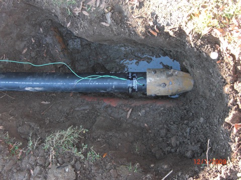 Pipe Burst Installation.  Bursting head that is hydraulcially pulled through the old pipe 1